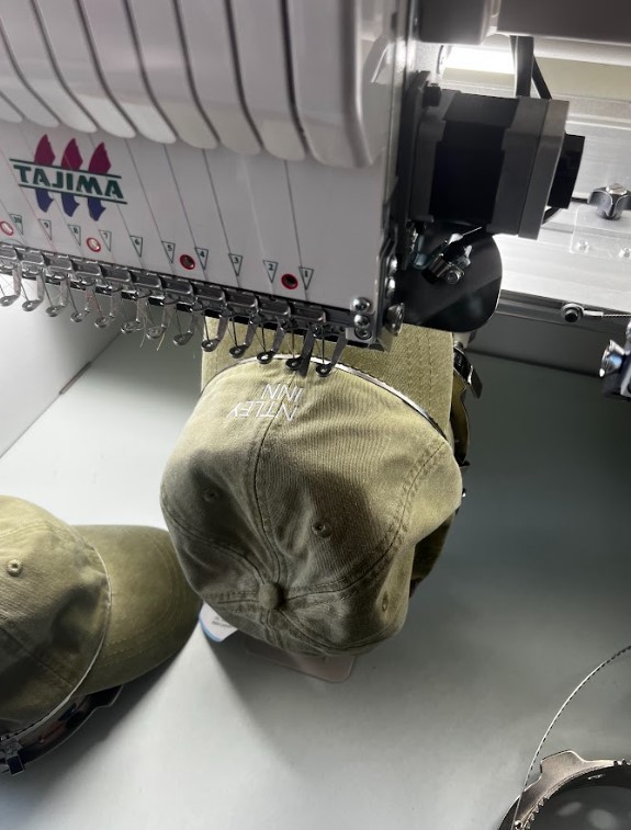 Industrial embroidery machine running an order in the Brick NJ shop
